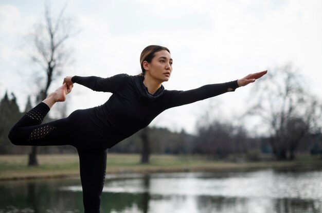 People practicing yoga outside