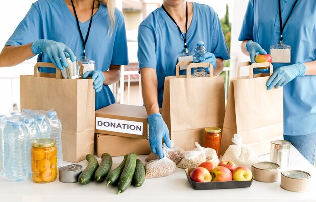 People preparing bags with provisions for food day