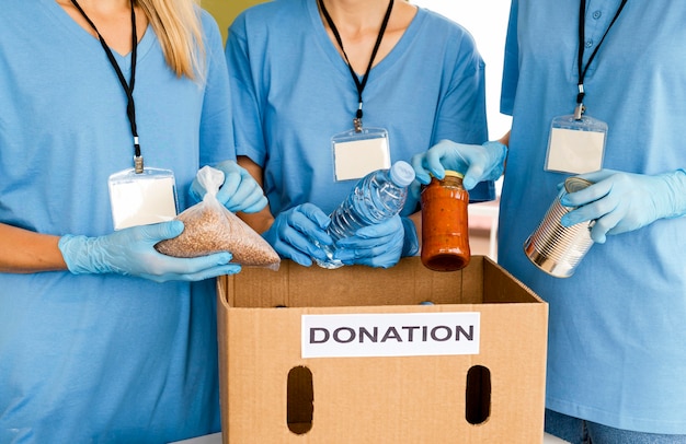 People preparing box with food for donation