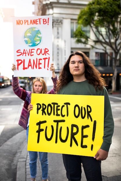 People protesting with placard in the city for world environment day