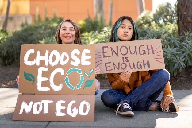 Free Photo people protesting with placards outdoors for world environment day