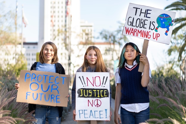 Free photo people protesting with placards outdoors for world environment day