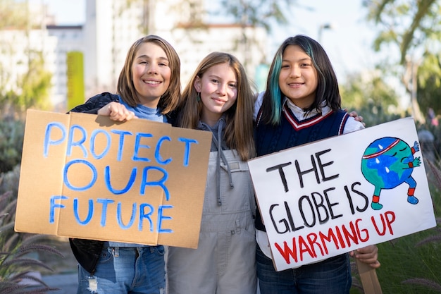 People protesting with placards outdoors for world environment day