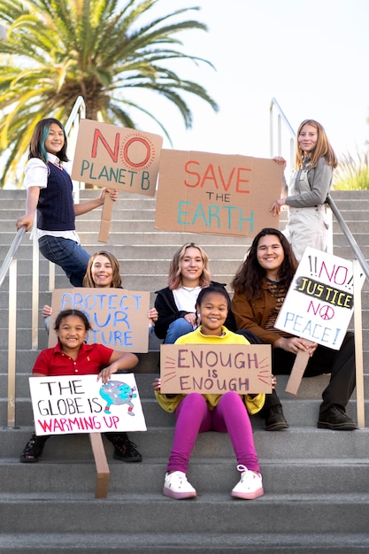 Free photo people protesting with placards outdoors for world environment day