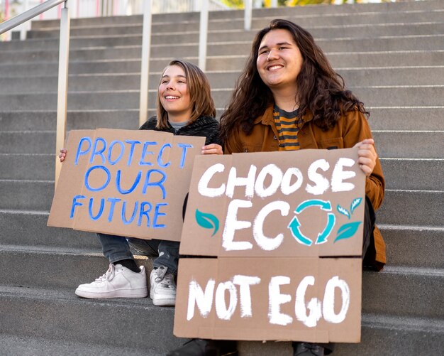 People protesting with placards outdoors for world environment day