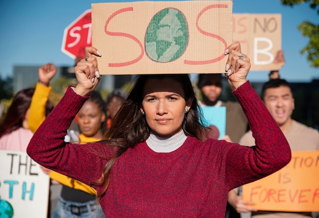 People protesting with placards outdoors