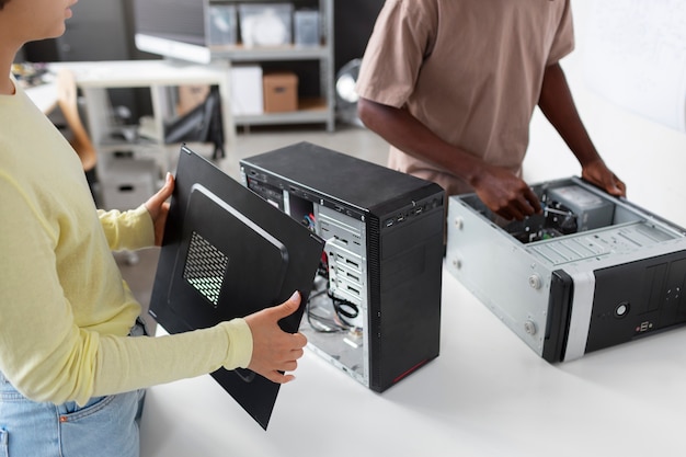 Free photo people repairing computer chips