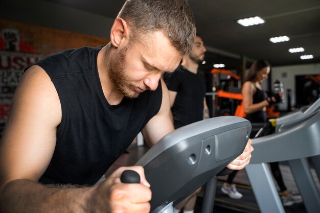 People running on treadmill side view