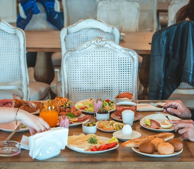 People sitting around breakfast table in a restaurant