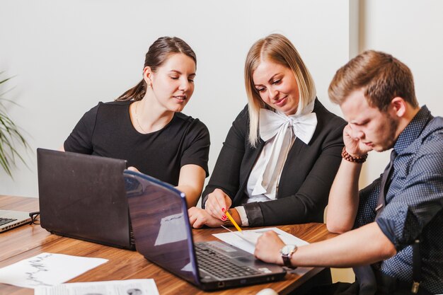 People sitting at desk talking