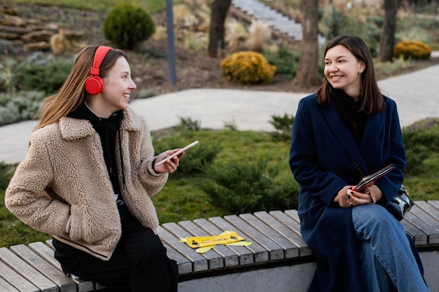 People sitting at distance on bench