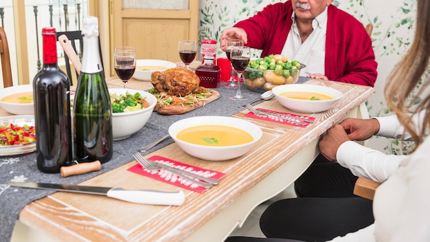 People sitting at festive table 