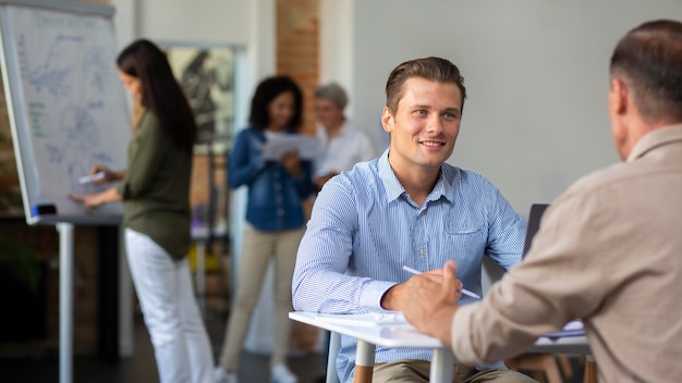 People smiling while in conference rom