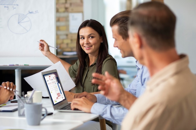 People smiling while in conference room