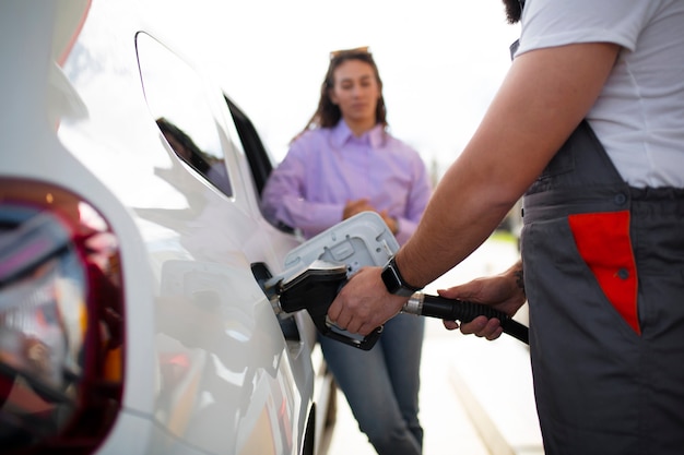 Free photo people spending time at the gas station