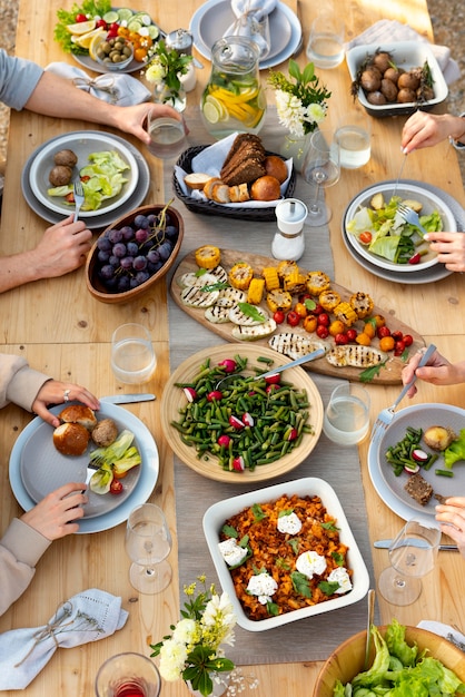 Free photo people at table with food close up