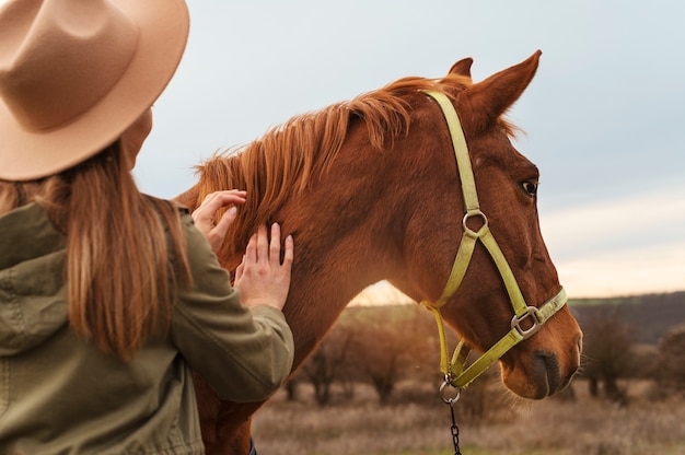 People taking care of the horse farm