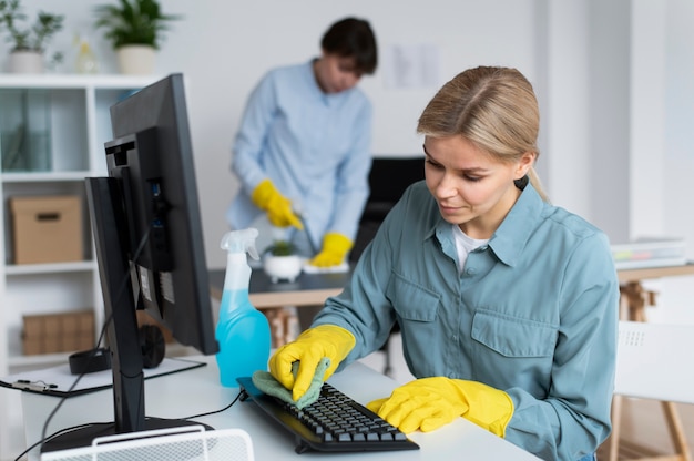 Free photo people taking care of office cleaning