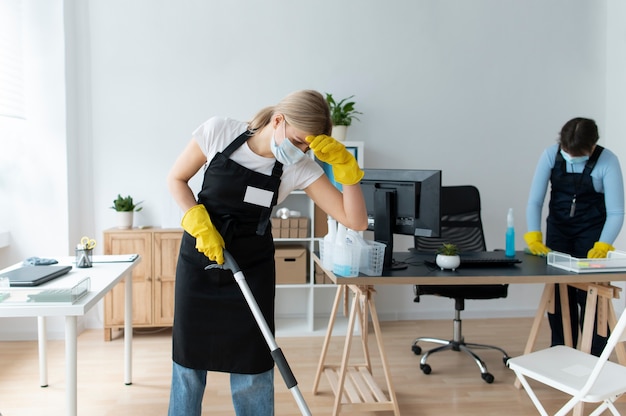 People taking care of office cleaning