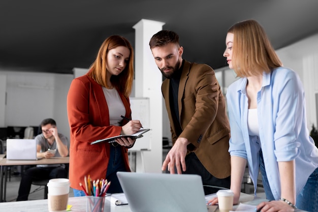 People talking in a group meeting at work