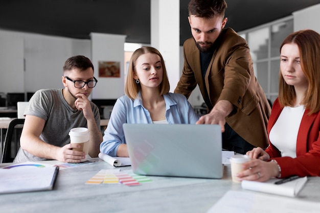 People talking in a group meeting at work