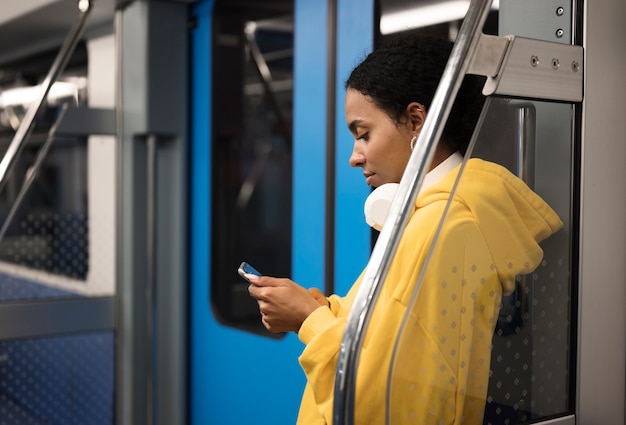 Free photo people traveling on the subway in winter time