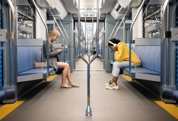 People traveling on the subway in winter time