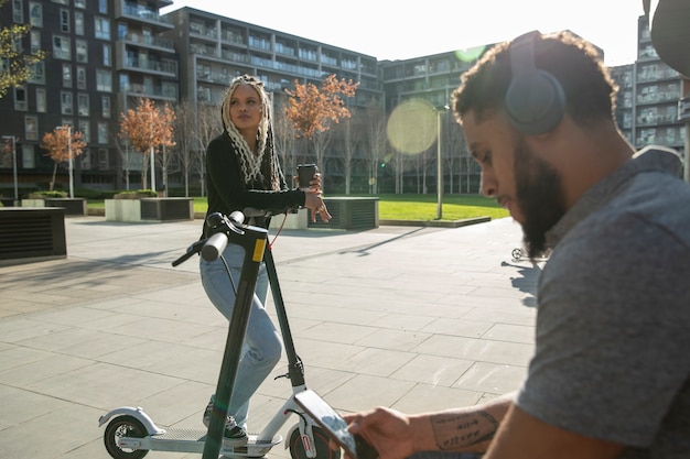 People with electric scooters medium shot