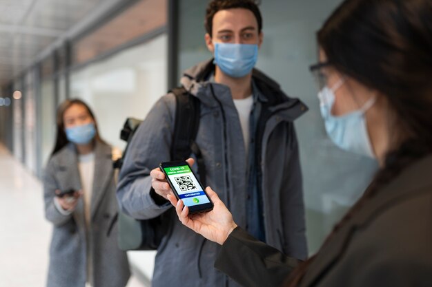 People with masks traveling with vaccination passport