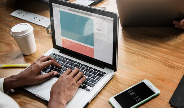 People working on a laptop in a meeting