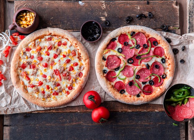 Pepperoni and chicken pizzas with mixed vegetables