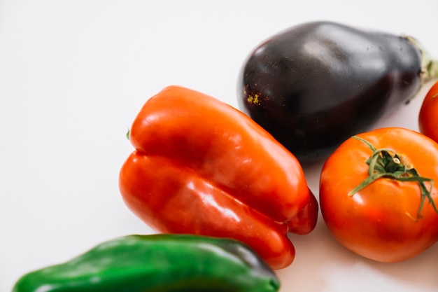 Free photo peppers, aubergine and tomato