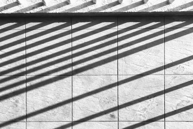 Perpendicular shadow lines on concrete wall