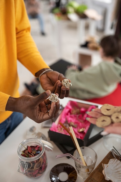 Free photo person at a barter event exchanging goods