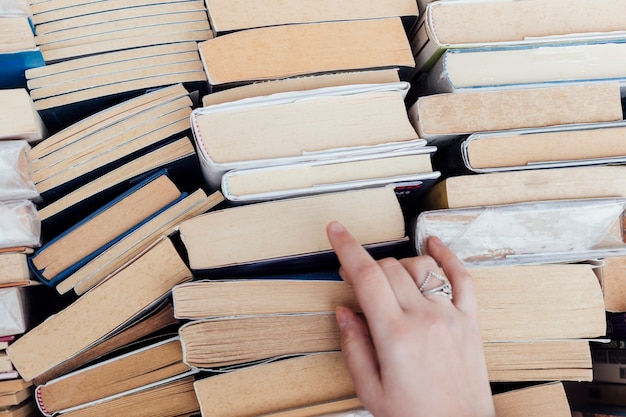 Free photo person choosing books at the bookstore