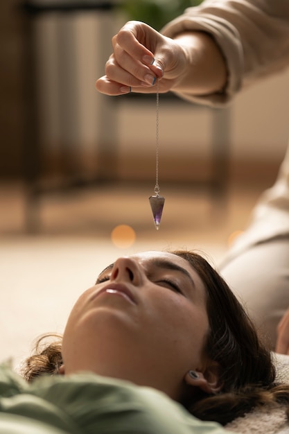 Free photo person conducting reiki therapy