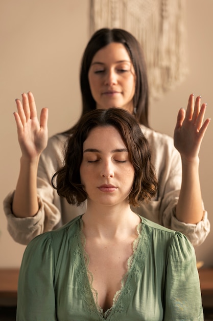 Person conducting reiki therapy