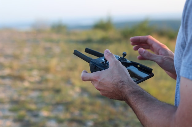 Free Photo person controlling a drone with a remote