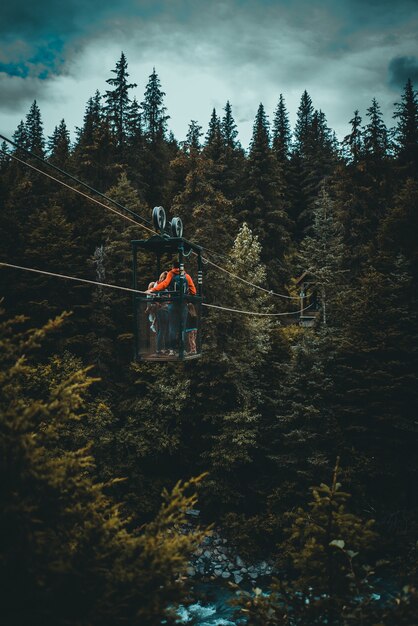 person crossing a river in a cabin