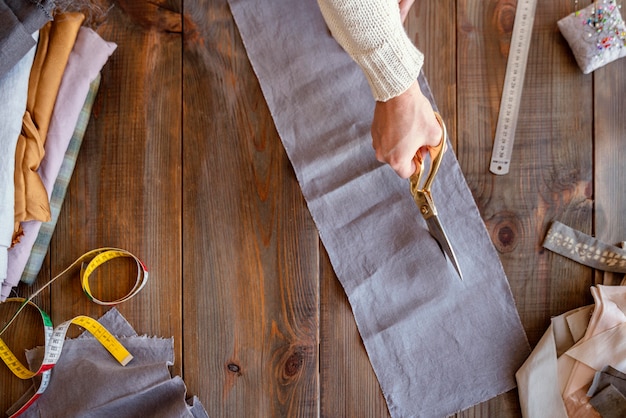 Person cutting fabric for sewing