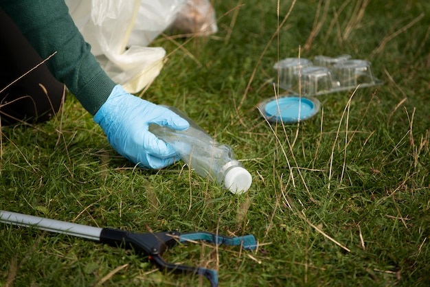 Free photo person doing community service by collecting trash