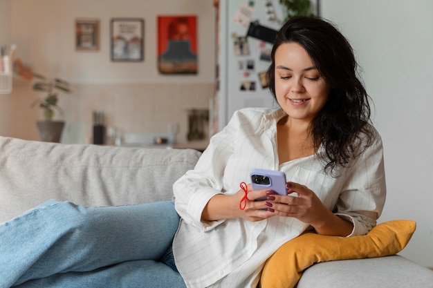 Person doing day-to- day activity while waring string on finger to remember something important