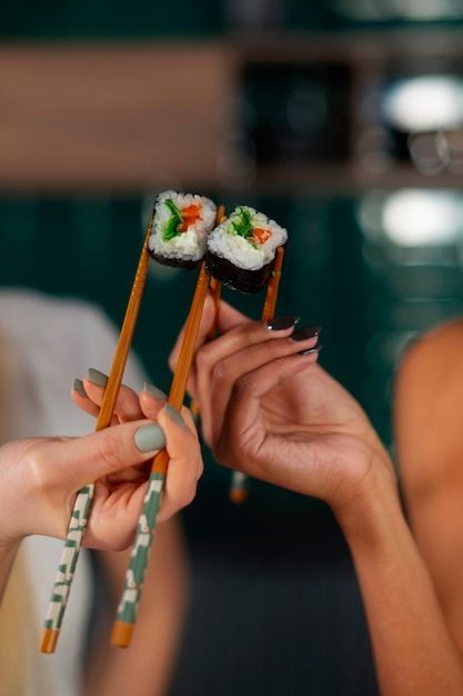 Free Photo person eating seaweed snacks