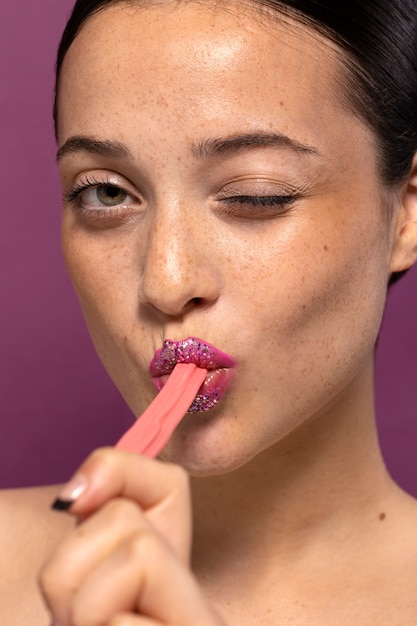 Free photo person eating a sweet candy desert