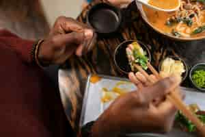 Free photo person enjoying food at restaurant