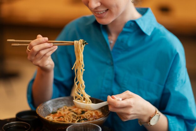 Person enjoying food at restaurant