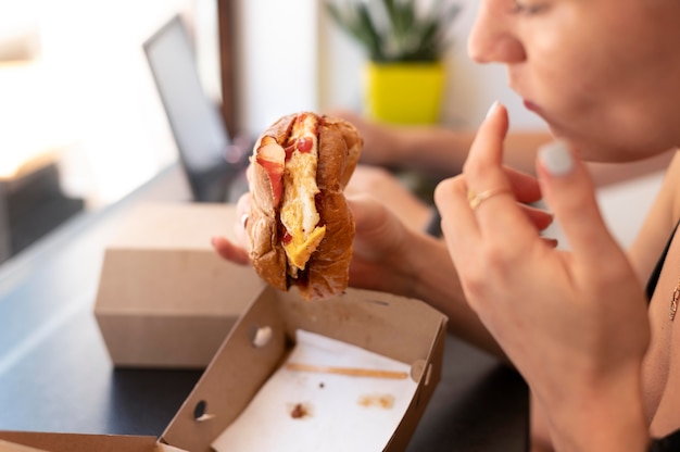 Person enjoying some takeaway burger