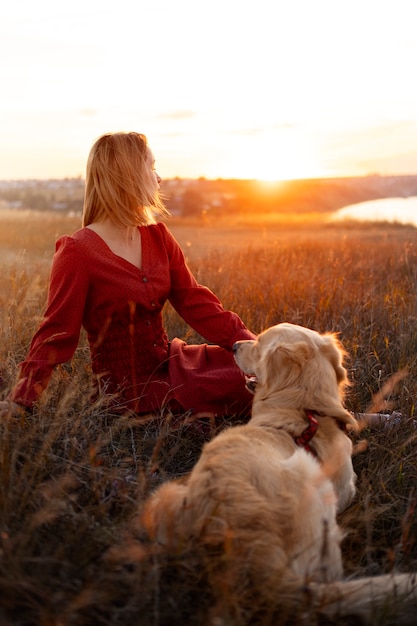 Free Photo person enjoying warm and nostalgic sunset