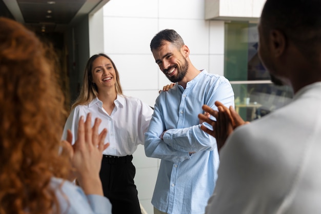 Free photo person expressing appreciation to their workmates