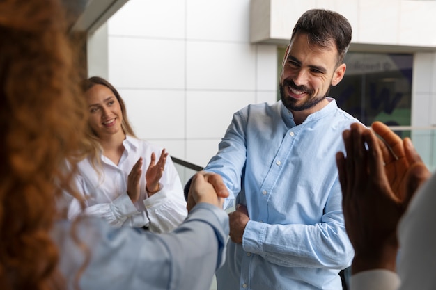 Person expressing appreciation to their workmates